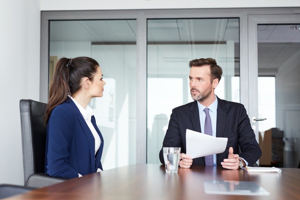 Male recruiter having an interview with female applicant