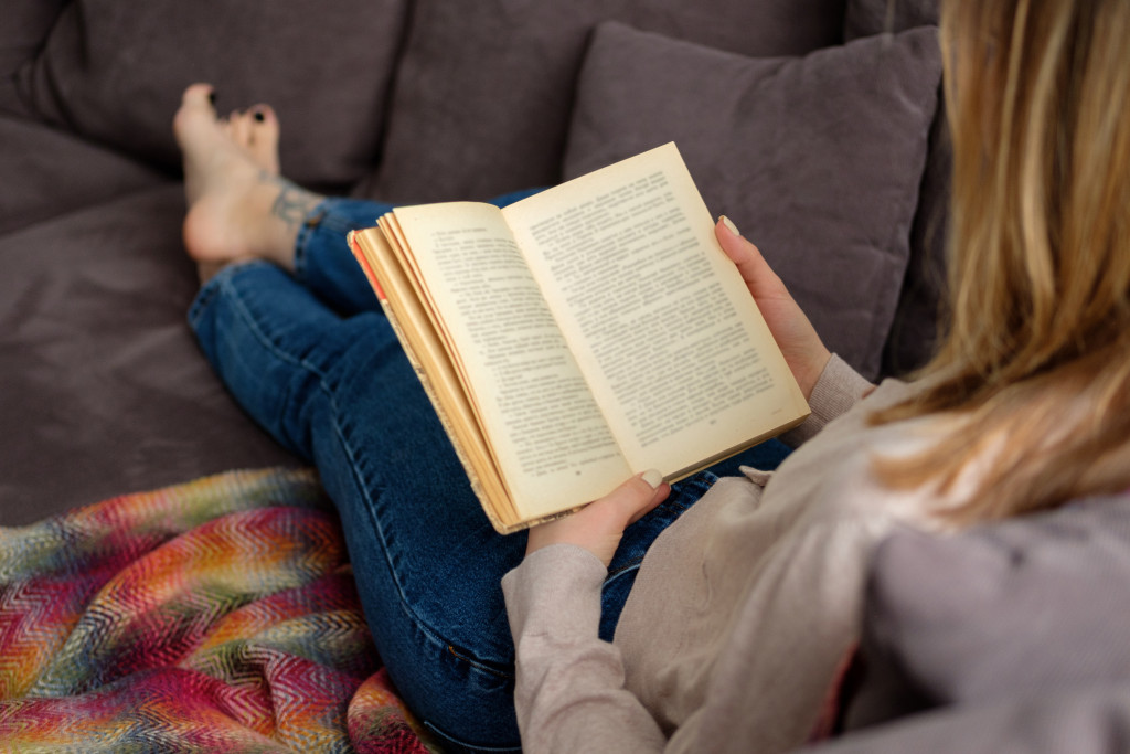 reading a book on the couch