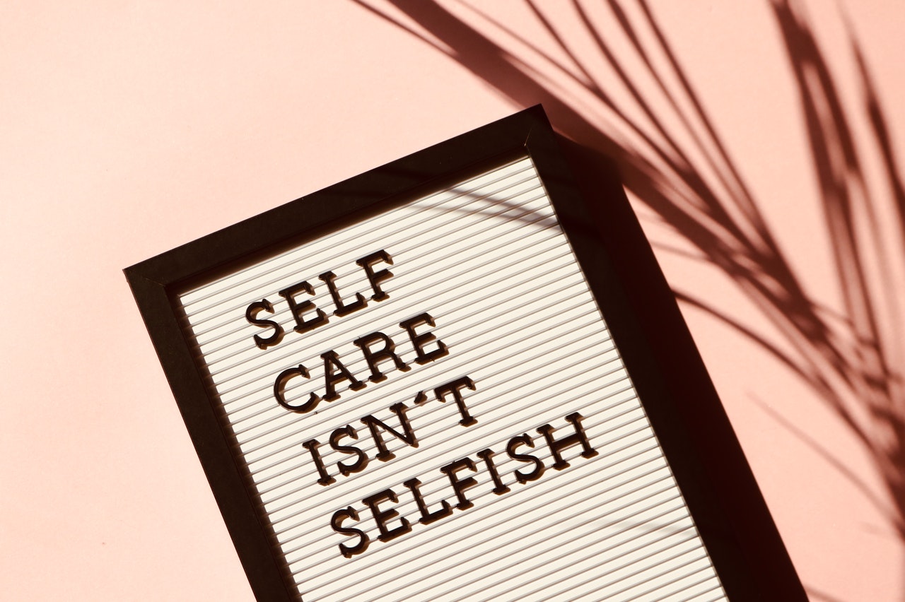 sign that reads self care isn't selfish