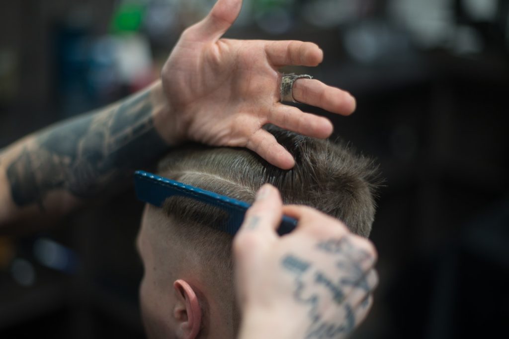 barber man combing hair