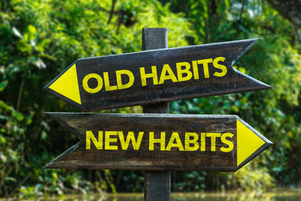 a sign board with old habits and new habits written on it