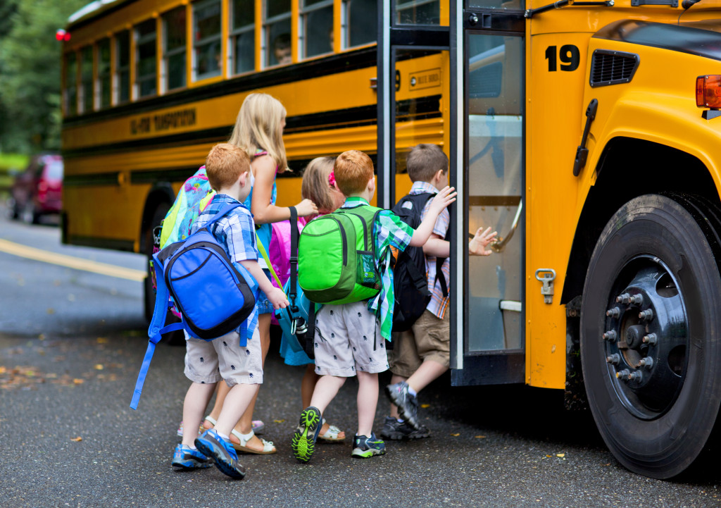 children boarding a bus