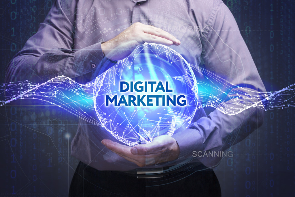 man holding a digital marketing globe