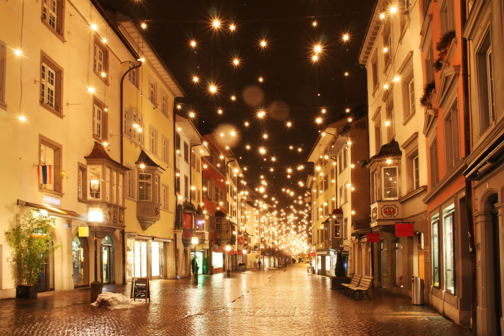 a street filled with city lights