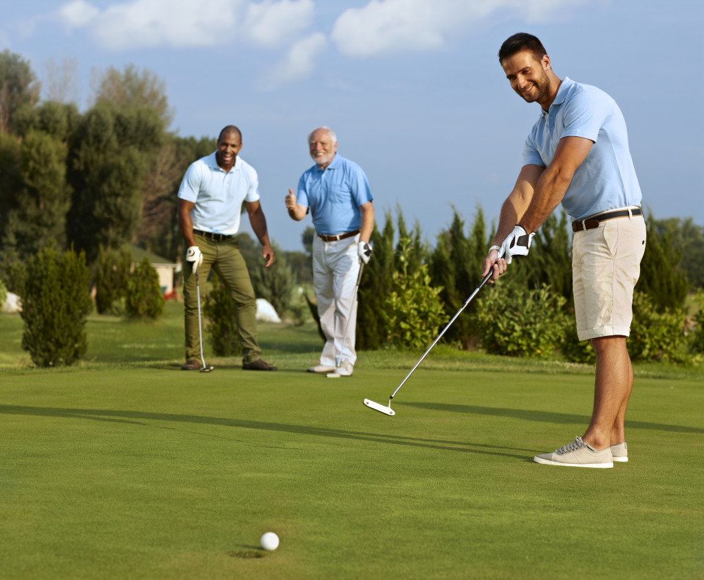 group of men playing golf
