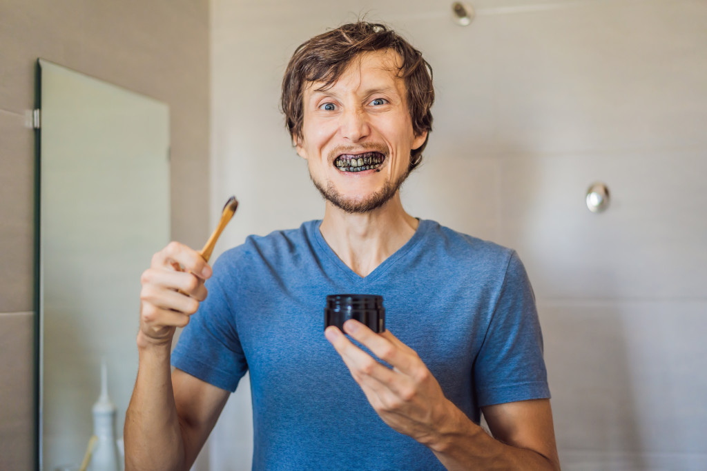 An entrepreneur using teeth whitening product