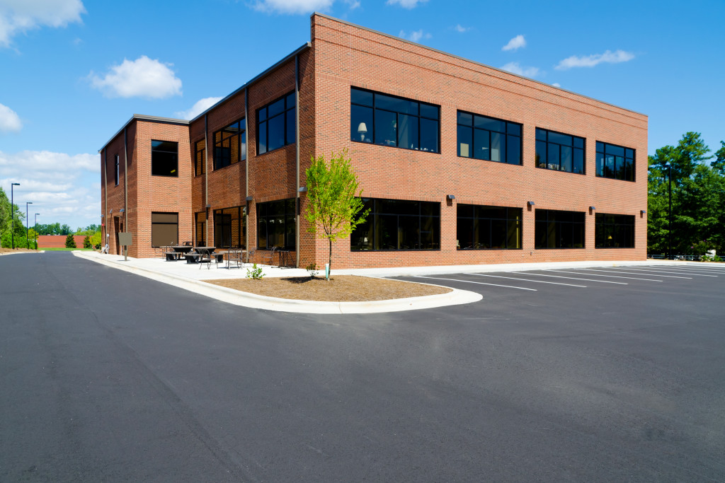side view of a brick building with an empty parking lot