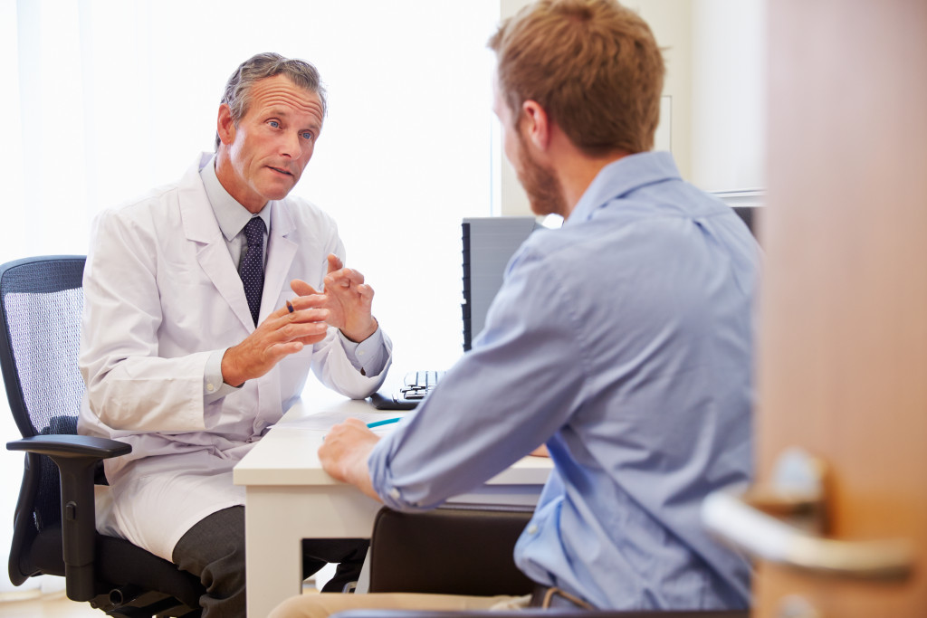 male doctor talking to a patient