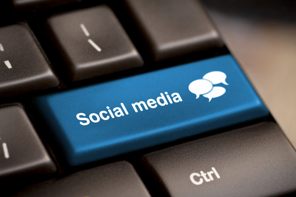 A blue social media button on a black keyboard