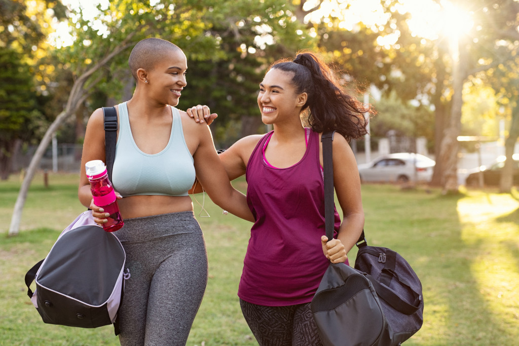 women going to park for fitness workout