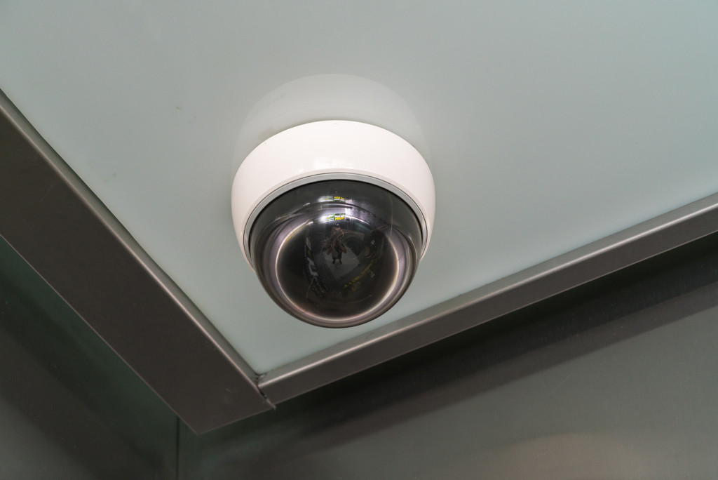A surveillance camera on the ceiling